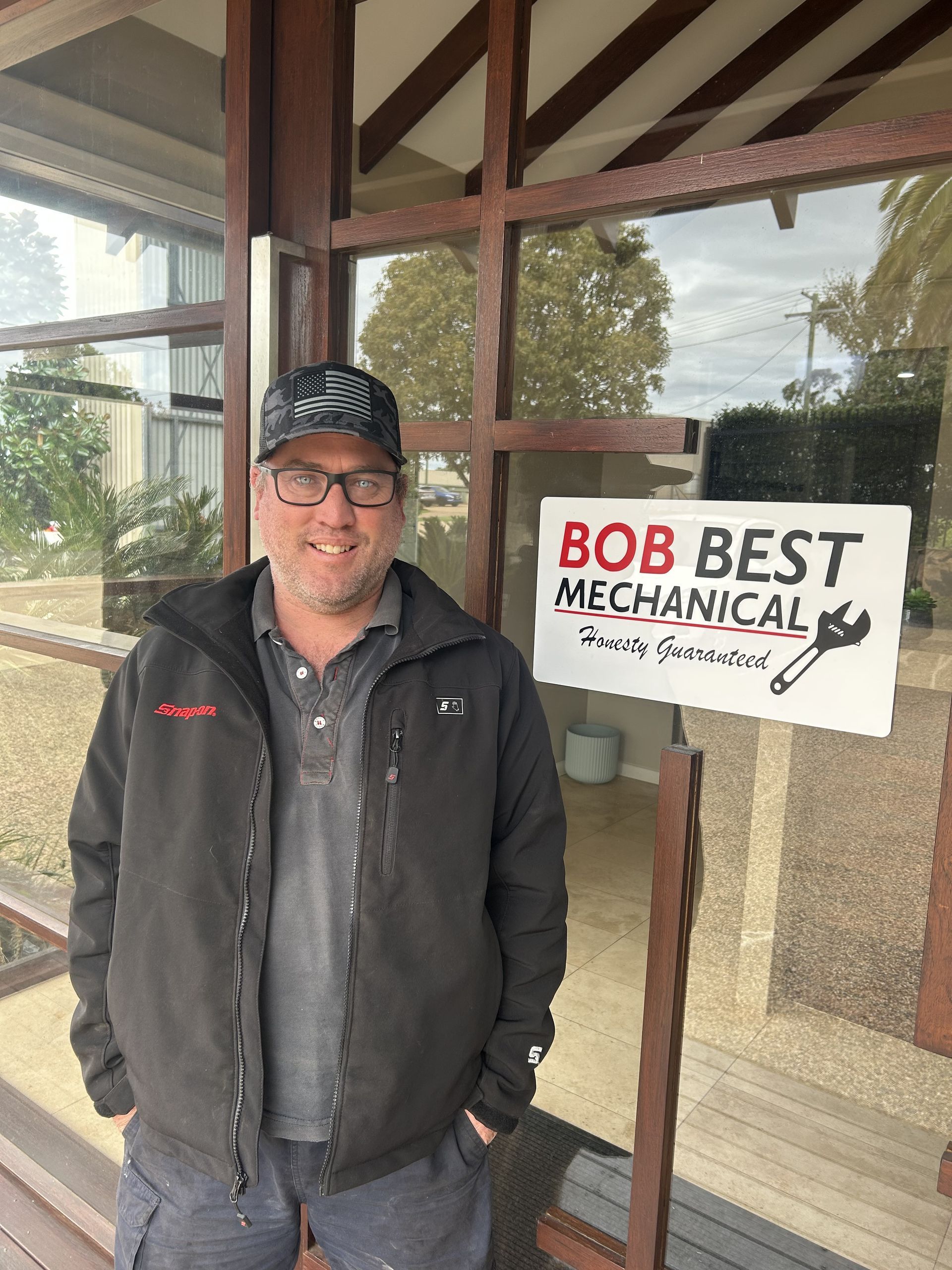 Business Owner Mechanic Standing at Working Office — Bob Best Mechanical in Drayton, QLD