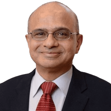 A bald man wearing glasses and a suit and tie