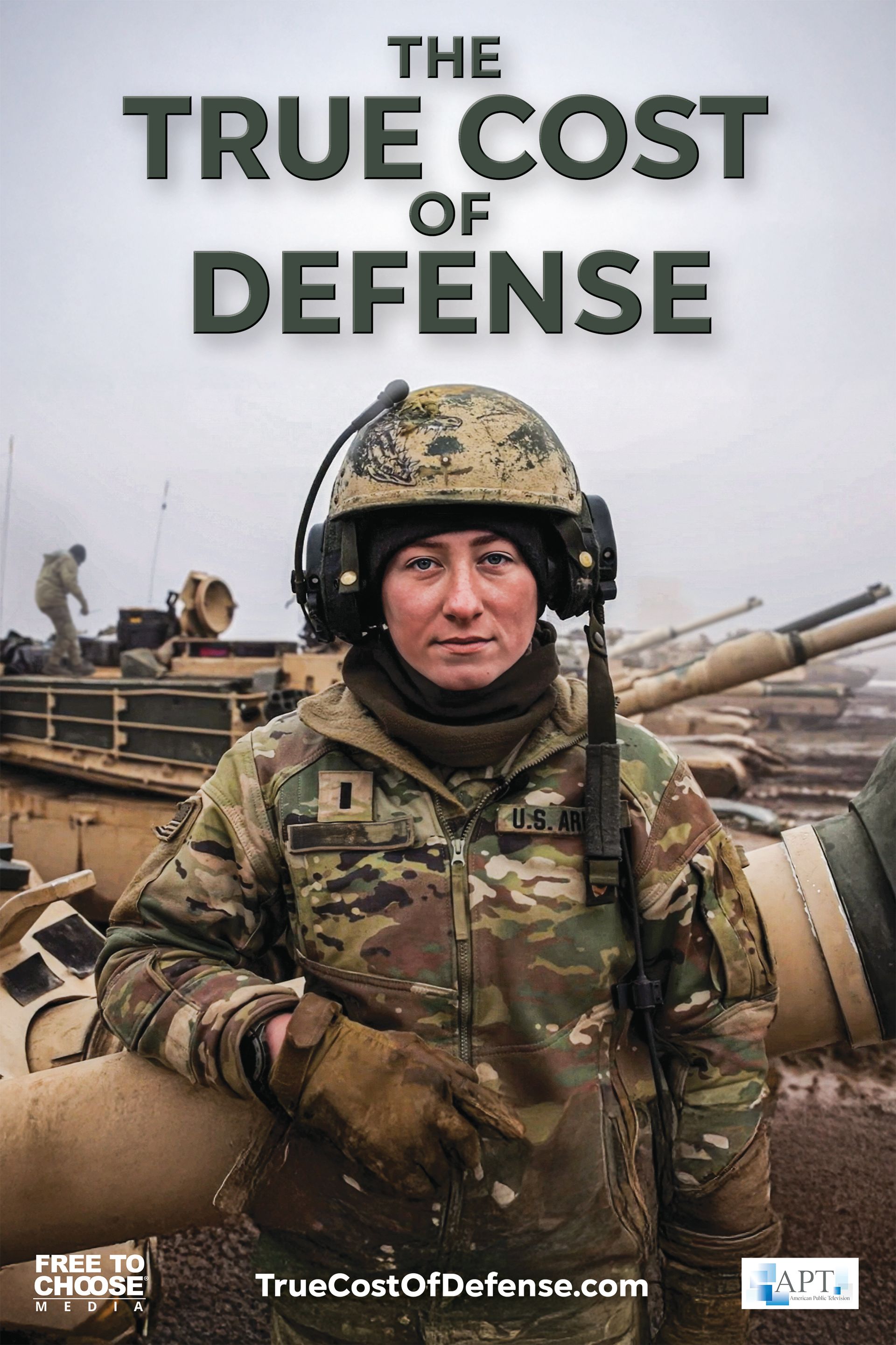 A soldier in uniform stands by a tank. Title:
