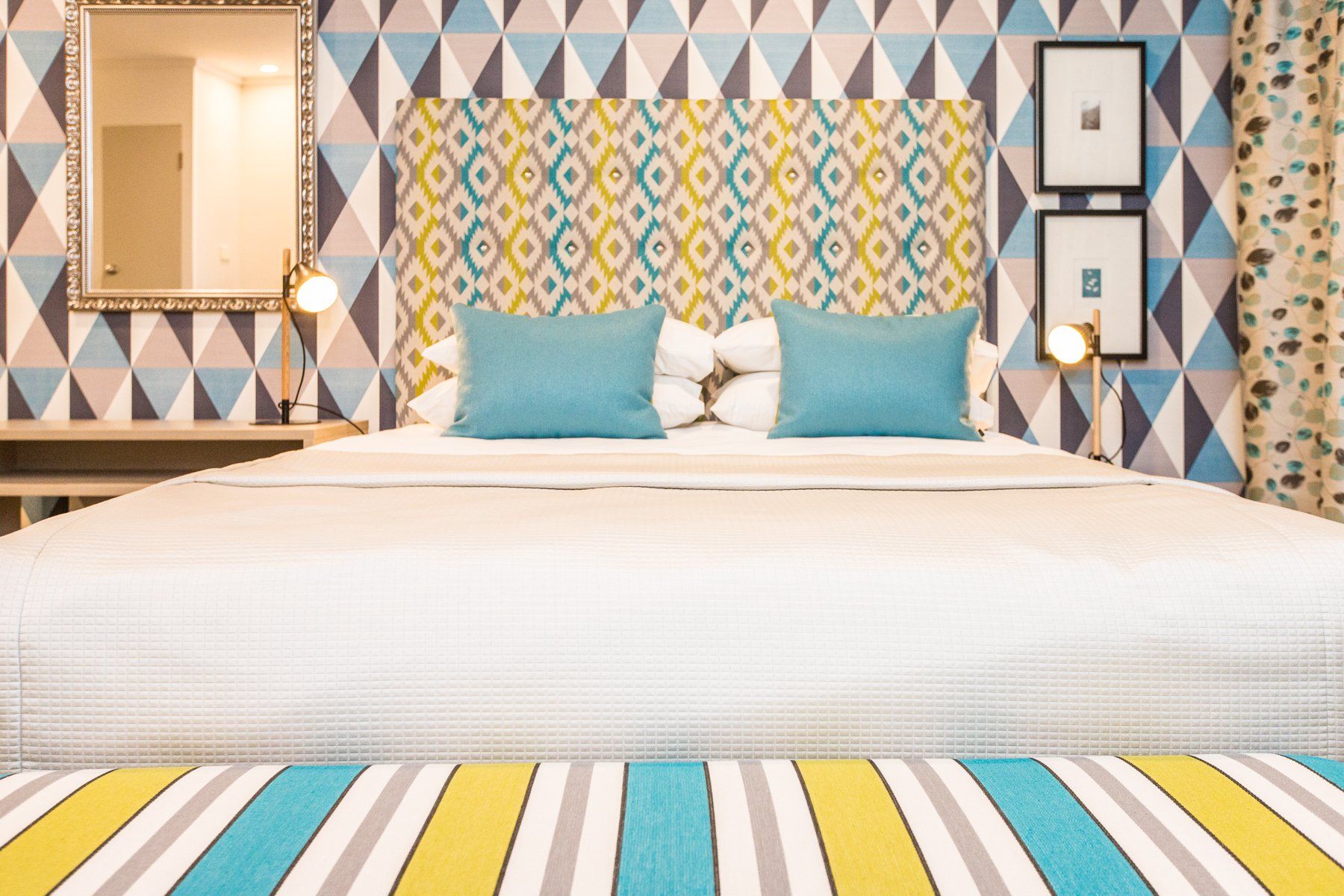 One bedroom suite teal king bed