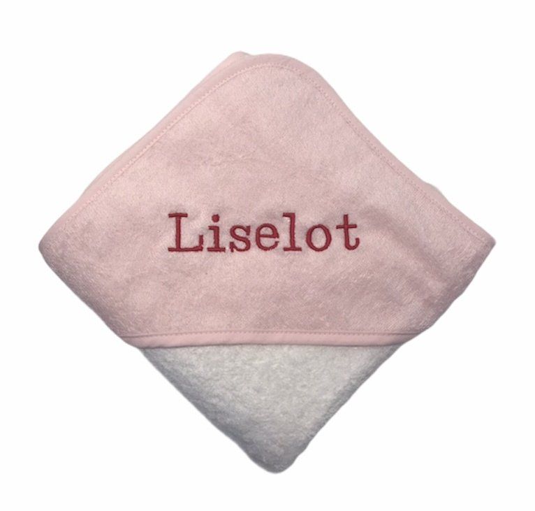 Roze-witte opgevouwen handdoek met de naam 
