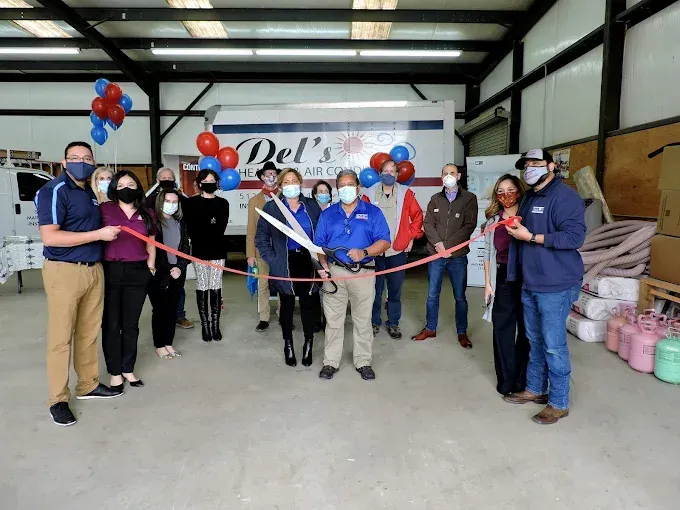 People cutting ribbon at 