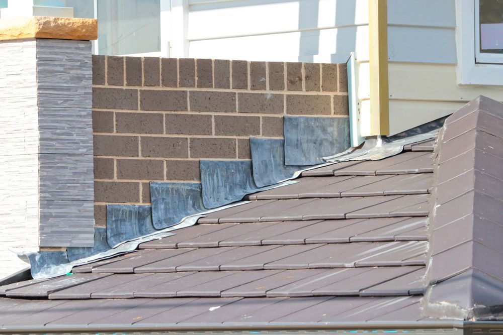 A Roof With a Chimney on the Side of It — SRV Roofing in Caloundra, QLD