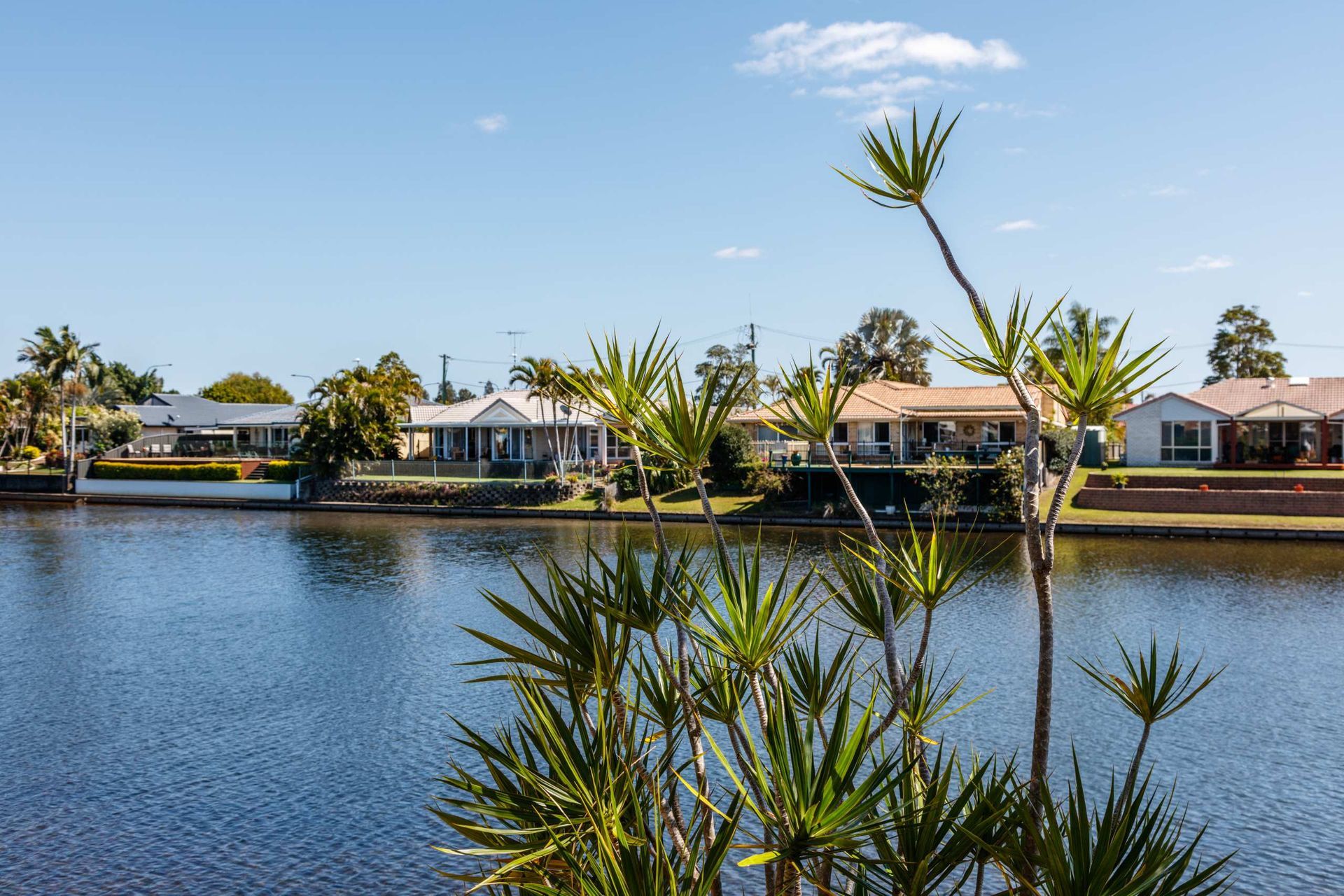 Calm Waterfront Neighborhood With Houses — SRV Roofing in Caloundra, QLD