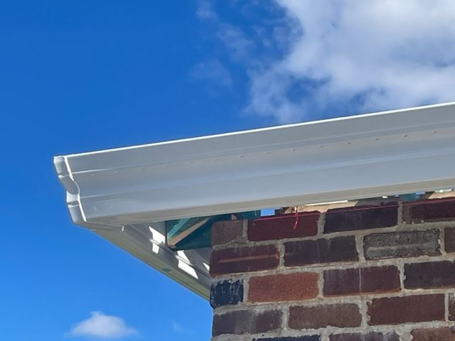 White Guttering on a Home with Red Roof — SRV Roofing in Gympie, QLD
