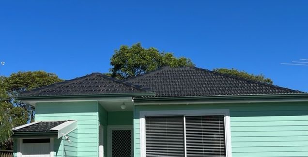 Metal Roof with Modern House Attic — SRV Roofing in Gympie, QLD