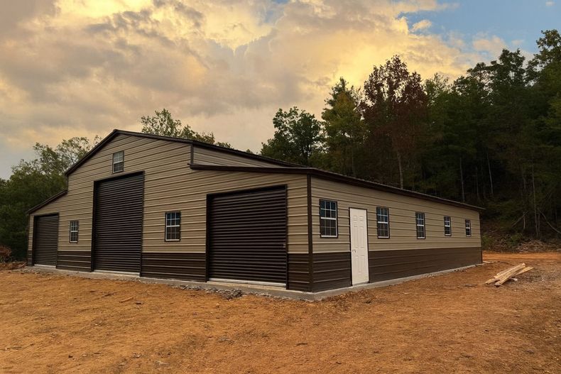 New beige and brown house under construction on a dirt lot near trees