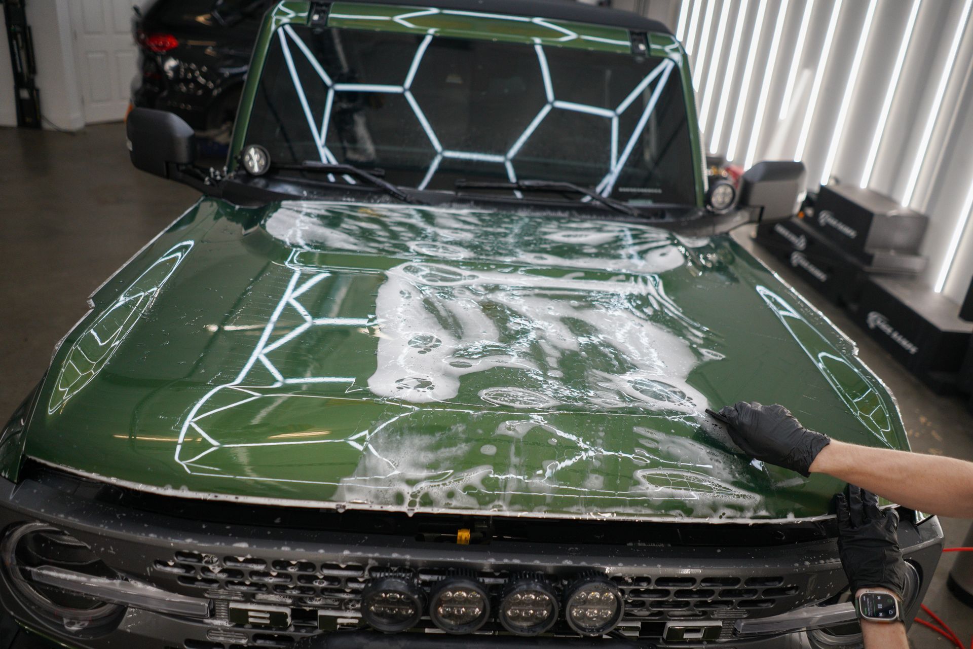 XPEL Ultimate Plus PPF installation on an Eruption Green Ford Bronco in Houston, Texas