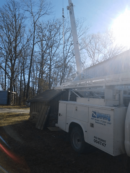 Truck Beside The House — Mountain Grove, MO — Harker Pump & Plumbing Truck Beside The House — Mountain Grove, MO — Harker Pump & Plumbing