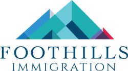 Logo for Foothills Immigration: geometric mountain in shades of teal, blue, and a touch of red. Text below.