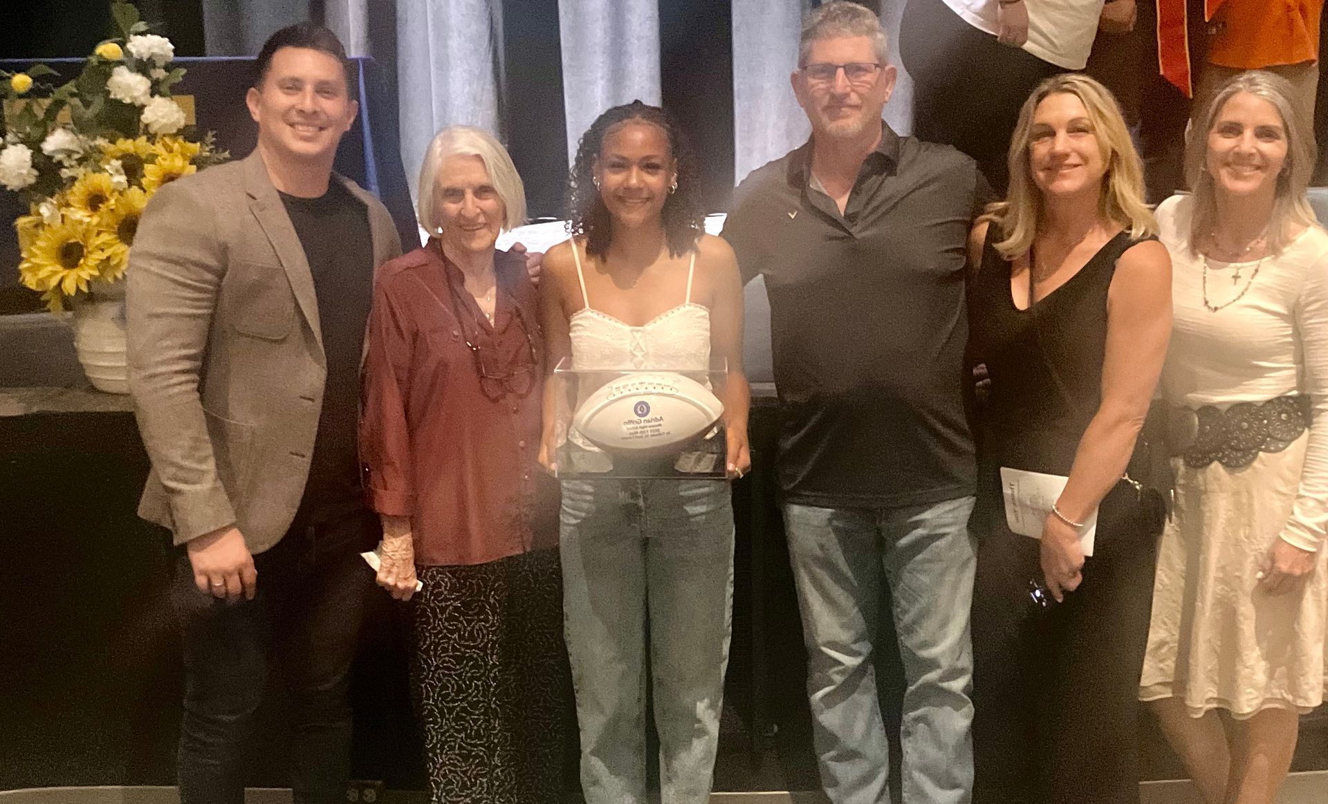 Recognition award at Marana HS with Favara family. Personalized football award.