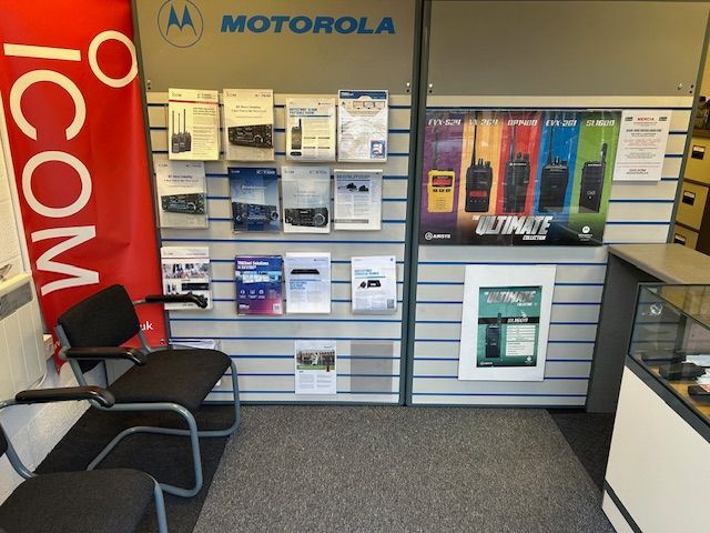 A motorola icom store with a display of walkie talkies