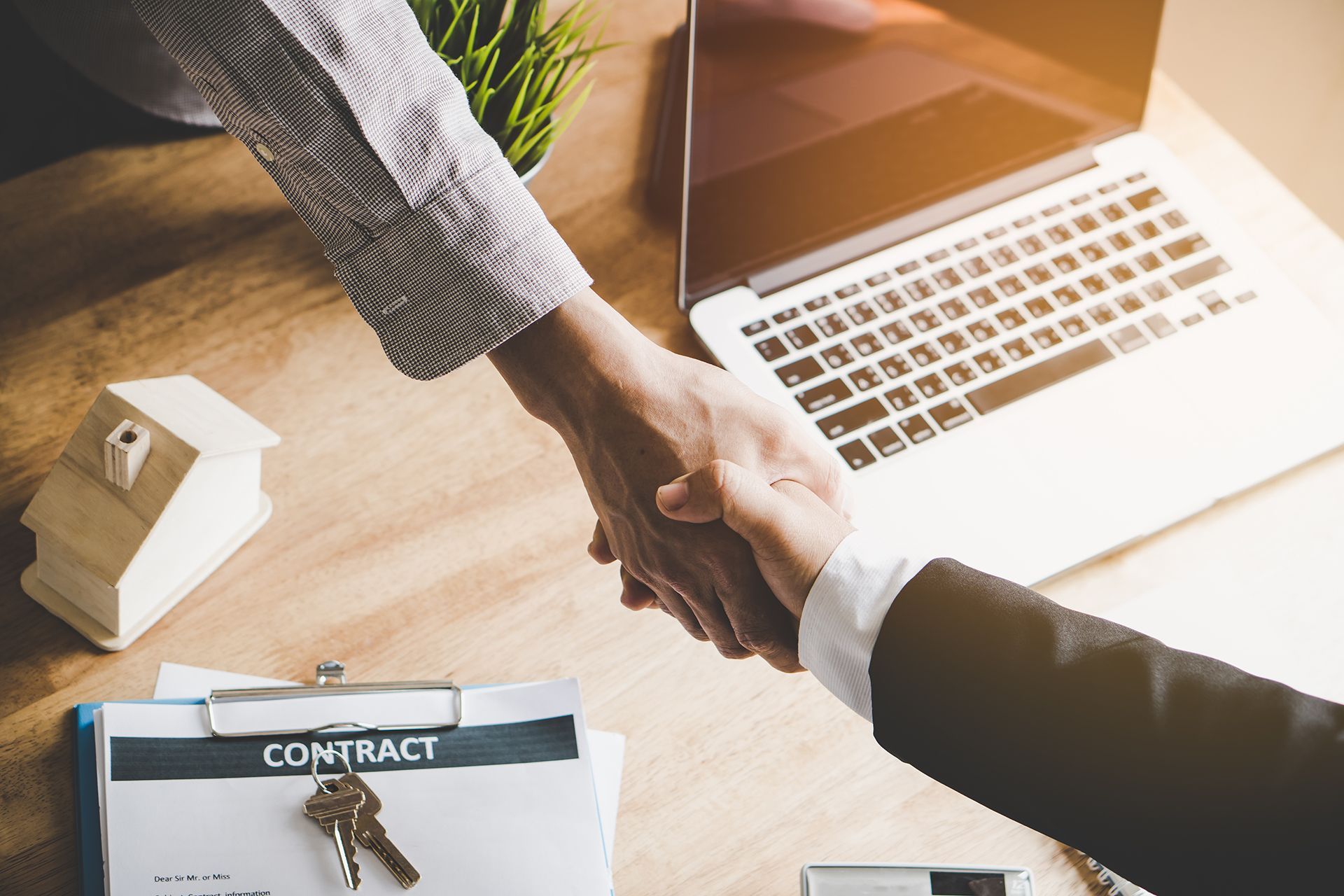 Real Estate Agent and Client Shaking Hands