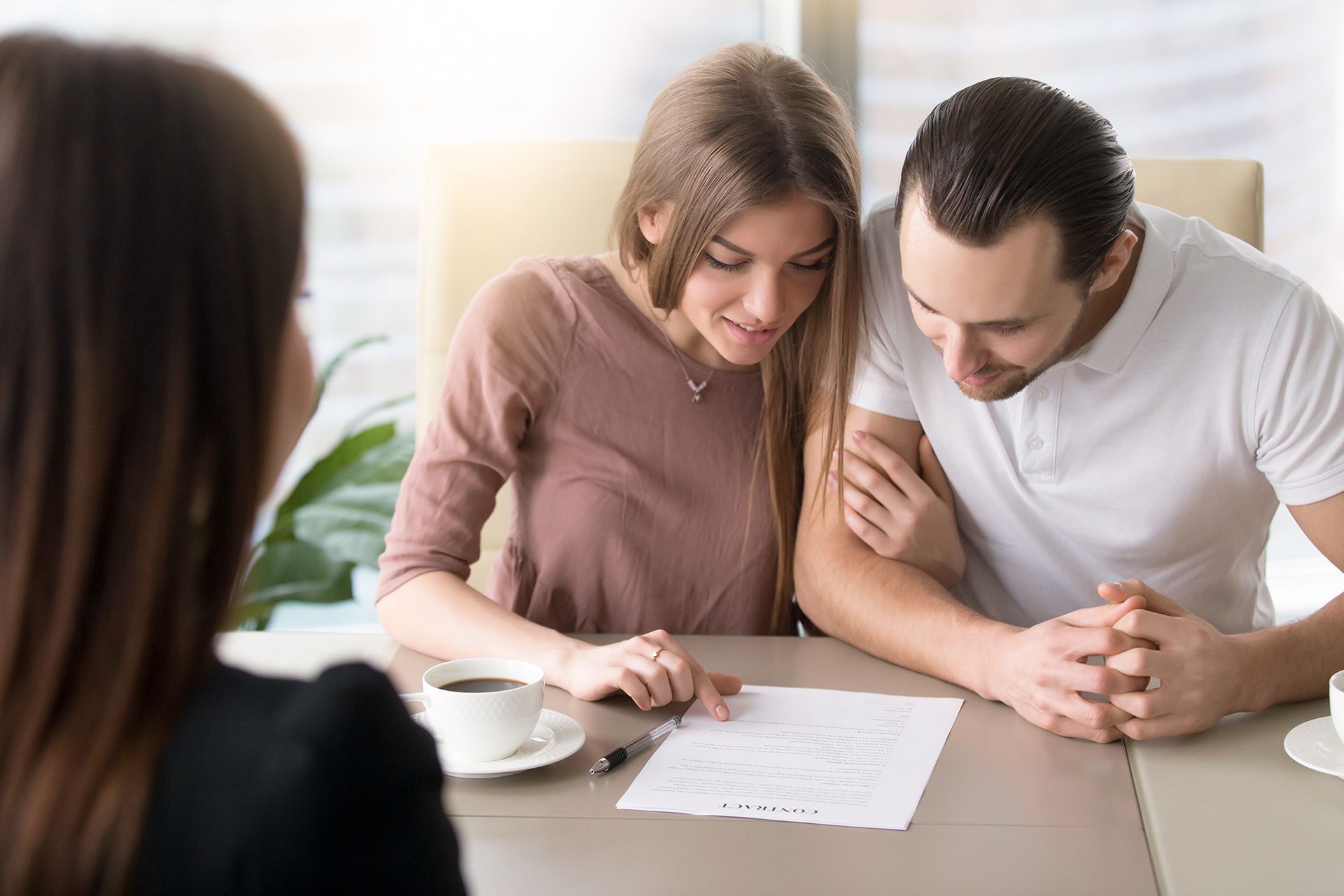 Couple Looking at the Real Estate Paper