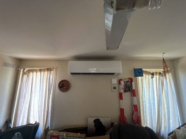 A Living Room With a Ceiling Fan and Air Conditioner — JW Electrical, Air & Solar Pty Ltd in Kew, NSW