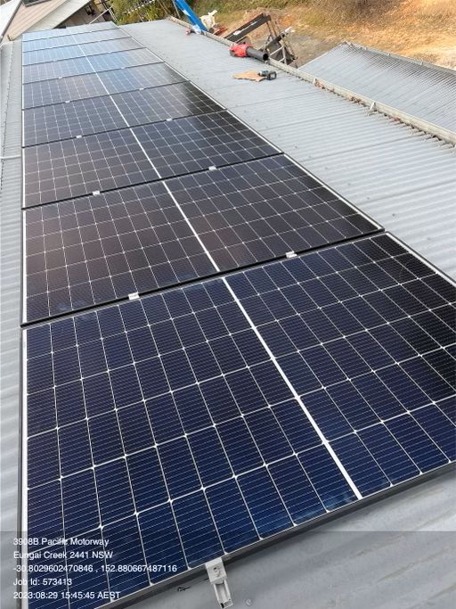 A Row of Solar Panels Sitting on Top of a Roof — JW Electrical, Air & Solar Pty Ltd in Kew, NSW