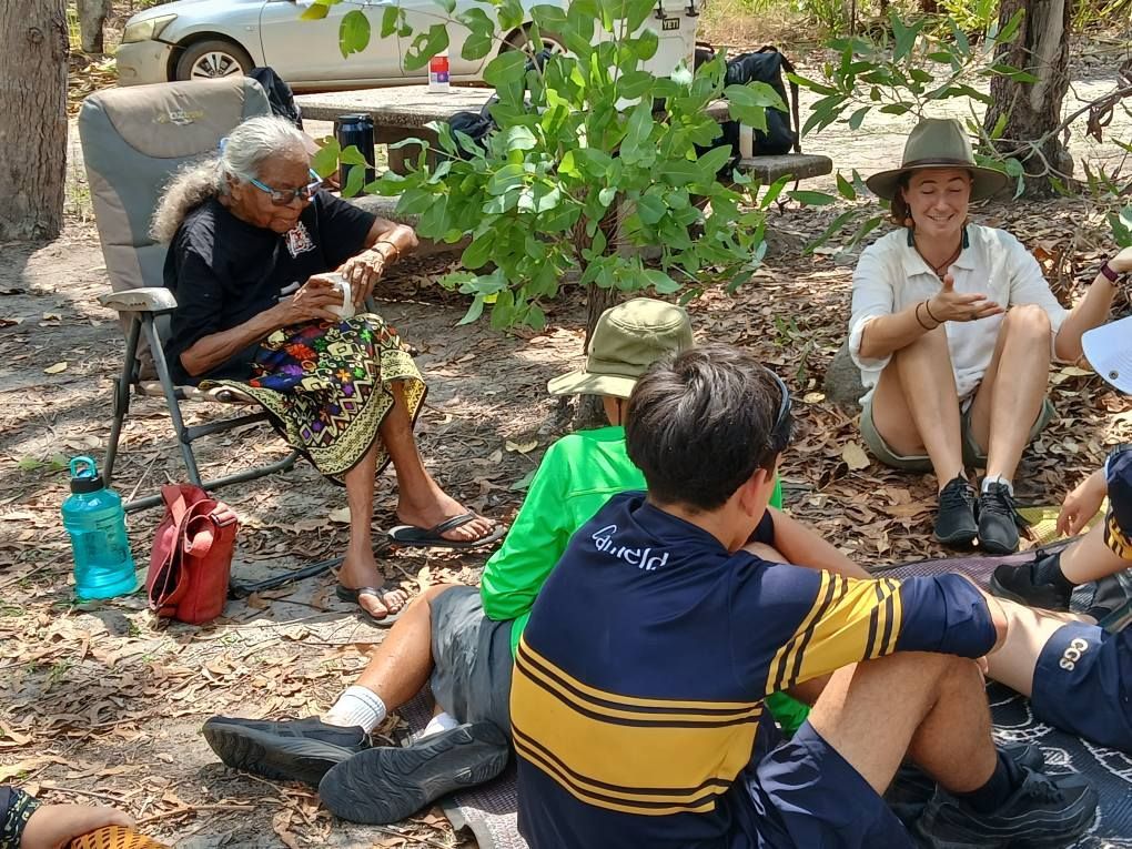 Group Seated on Ground Listening to a Person — Kakadu Billabong Safari Camp in Kakadu, NT