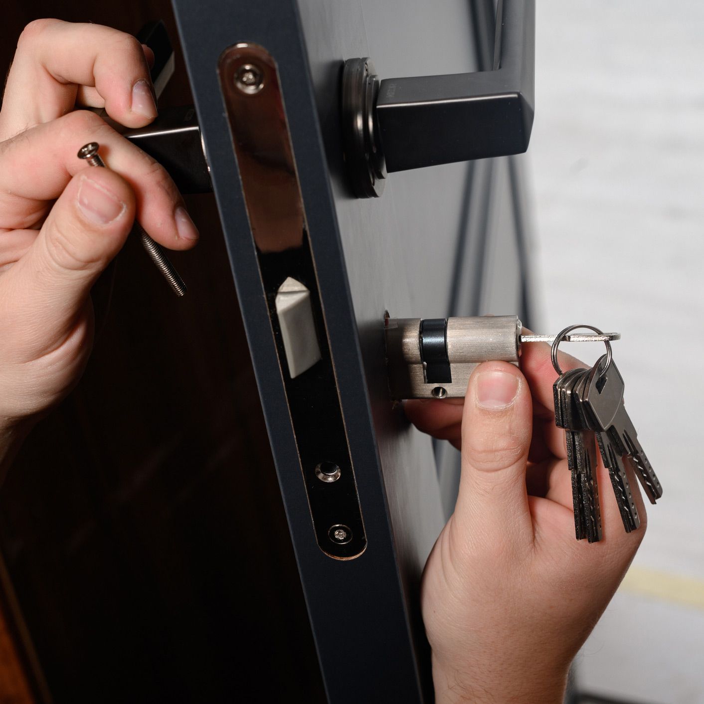 Installing Door Lock — Loveland, CO — Pop-A-Lock Of Northern Colorado Installing Door Lock — Loveland, CO — Pop-A-Lock Of Northern Colorado