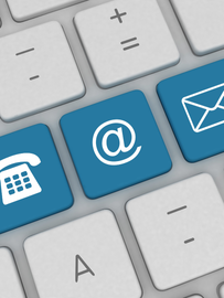 A keyboard with a phone envelope and email buttons