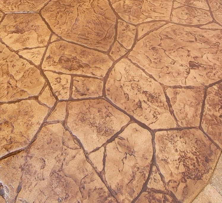 A close up of a concrete floor with a rock pattern