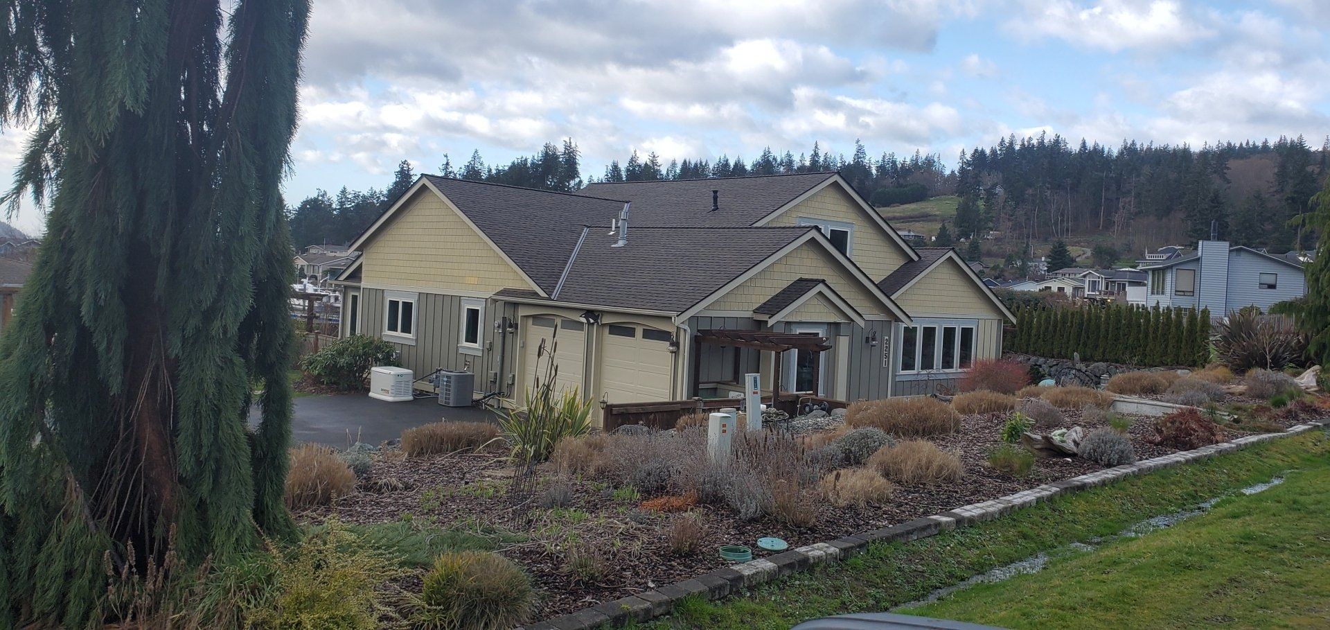 A large house with a roof that is covered in shingles