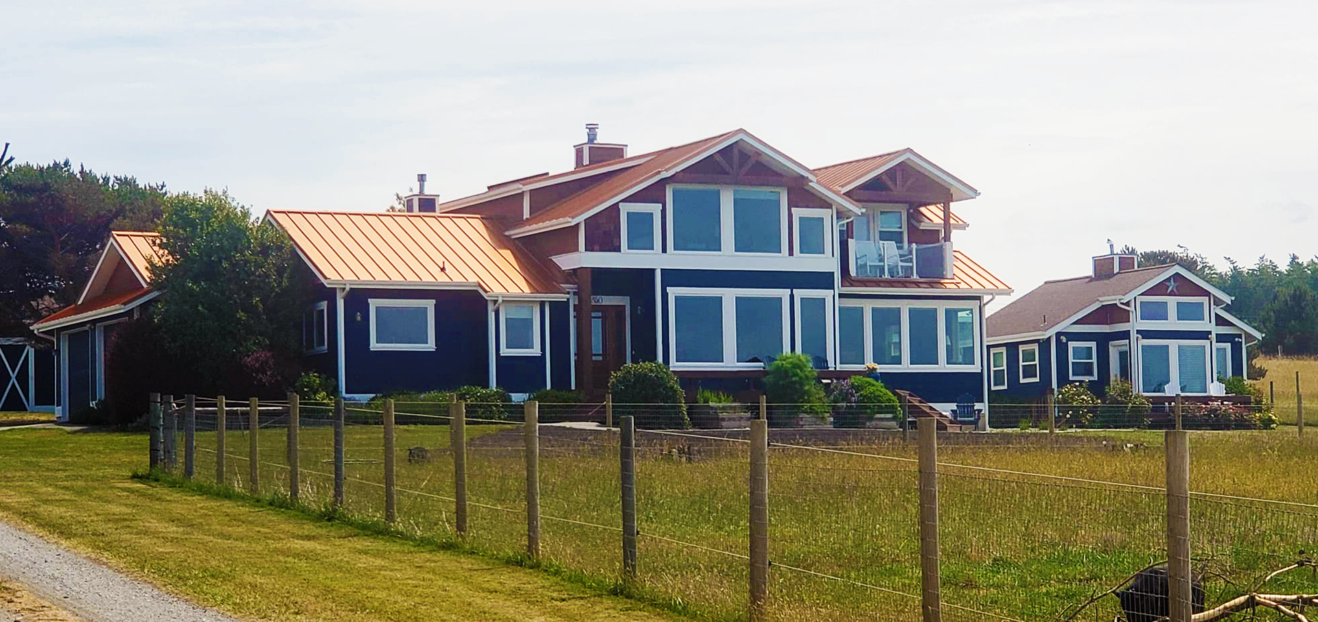 A large house with a fence in front of it