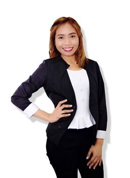 A smiling person wearing a dark blazer over a white blouse with hands on their hips, against a plain white background.