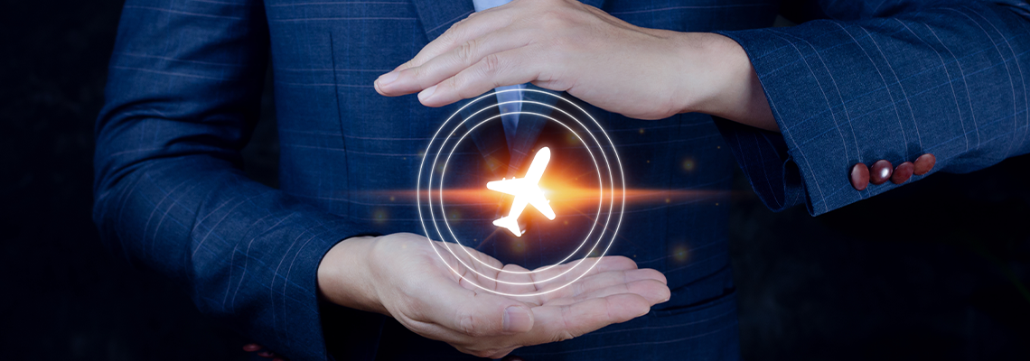 Hands framing a glowing orange airplane icon on a dark blue background
