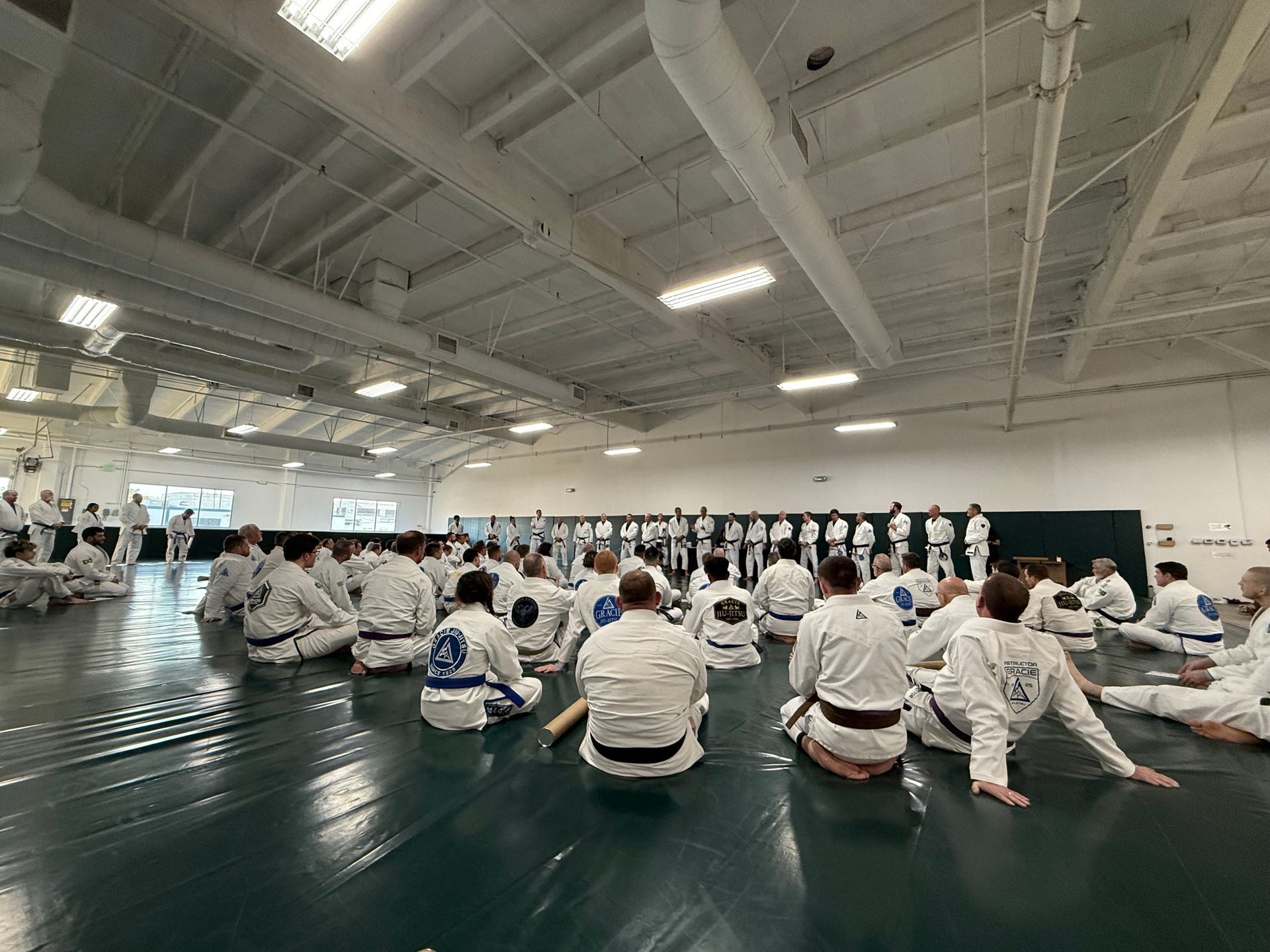 Adults practicing Brazilian Jiu-Jitsu technique at Gracie Jiu-Jitsu San Jose in San Jose, CA for confidence and fitness.