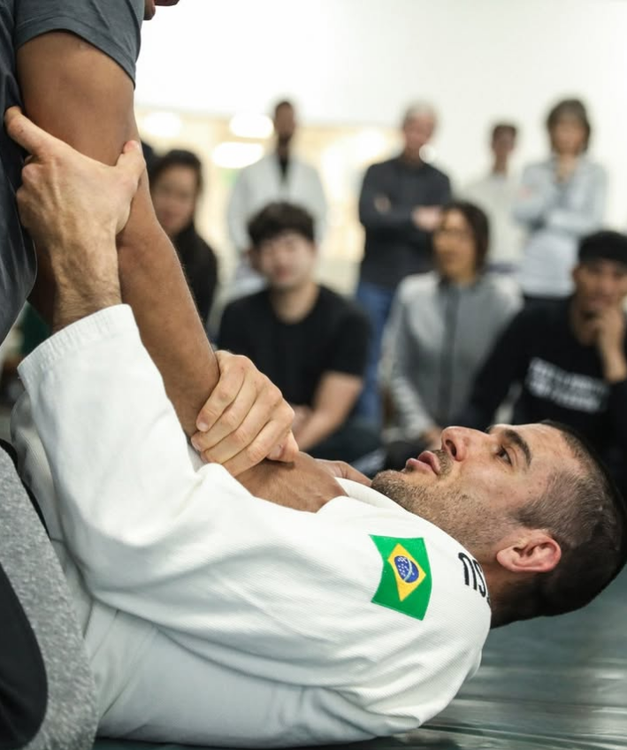 Partners drill Jiu-Jitsu technique at Gracie Jiu-Jitsu San Jose in San Jose, CA, building calm strength.