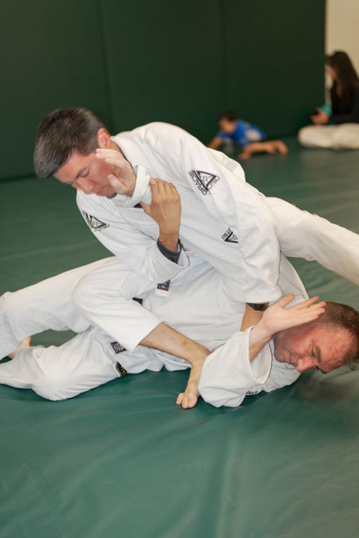 Adults practicing controlled Jiu-Jitsu drills at Gracie Jiu-Jitsu San Jose in San Jose, CA for focus and energy.
