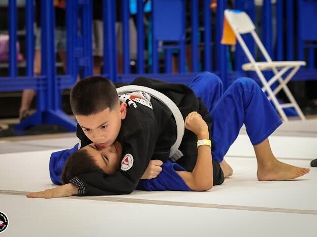 Adults training Jiu-Jitsu at Gracie Jiu-Jitsu San Jose in San Jose, CA, practicing calm focus under pressure.