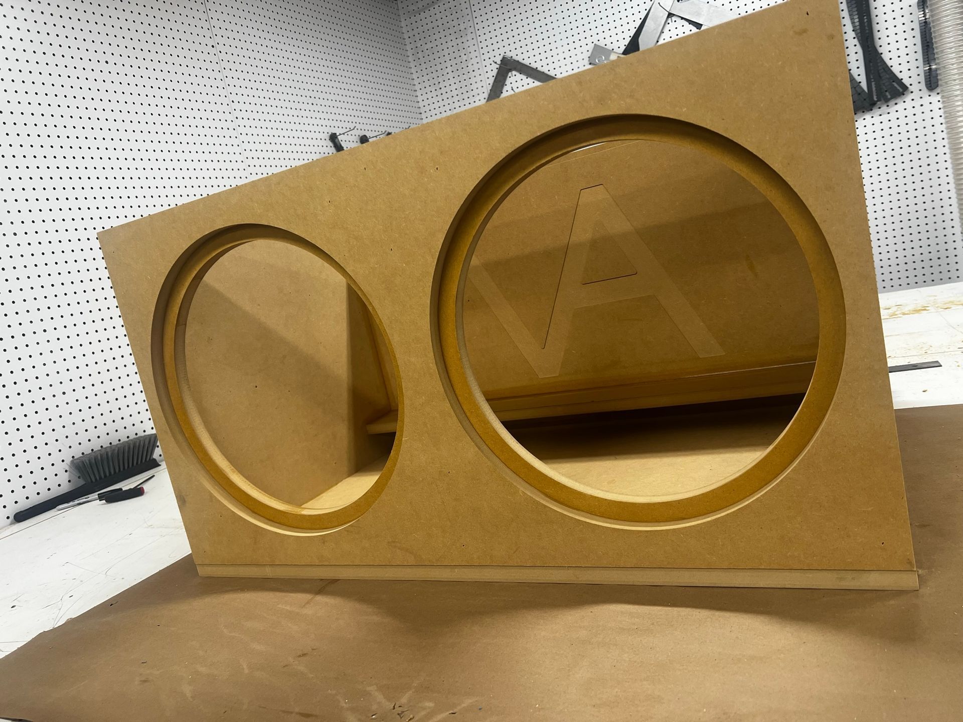 A wooden box with two circles on it