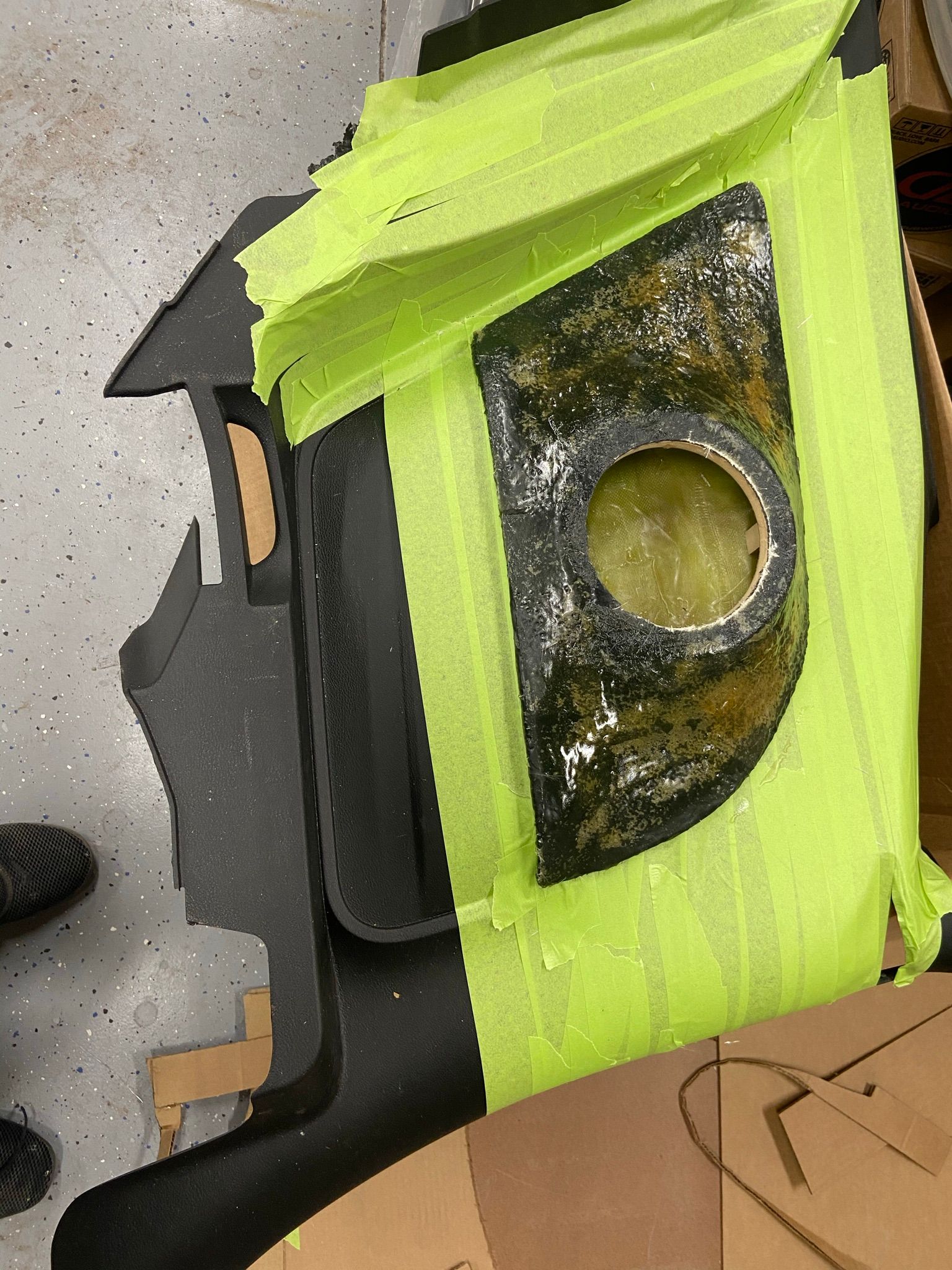 A piece of black and yellow tape with a hole in it