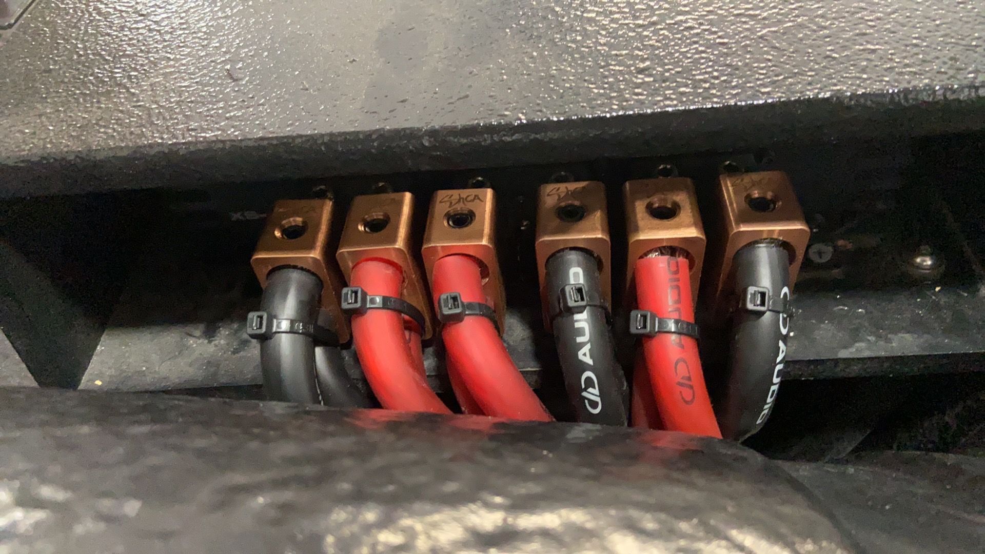 A bunch of wires are connected to a black box