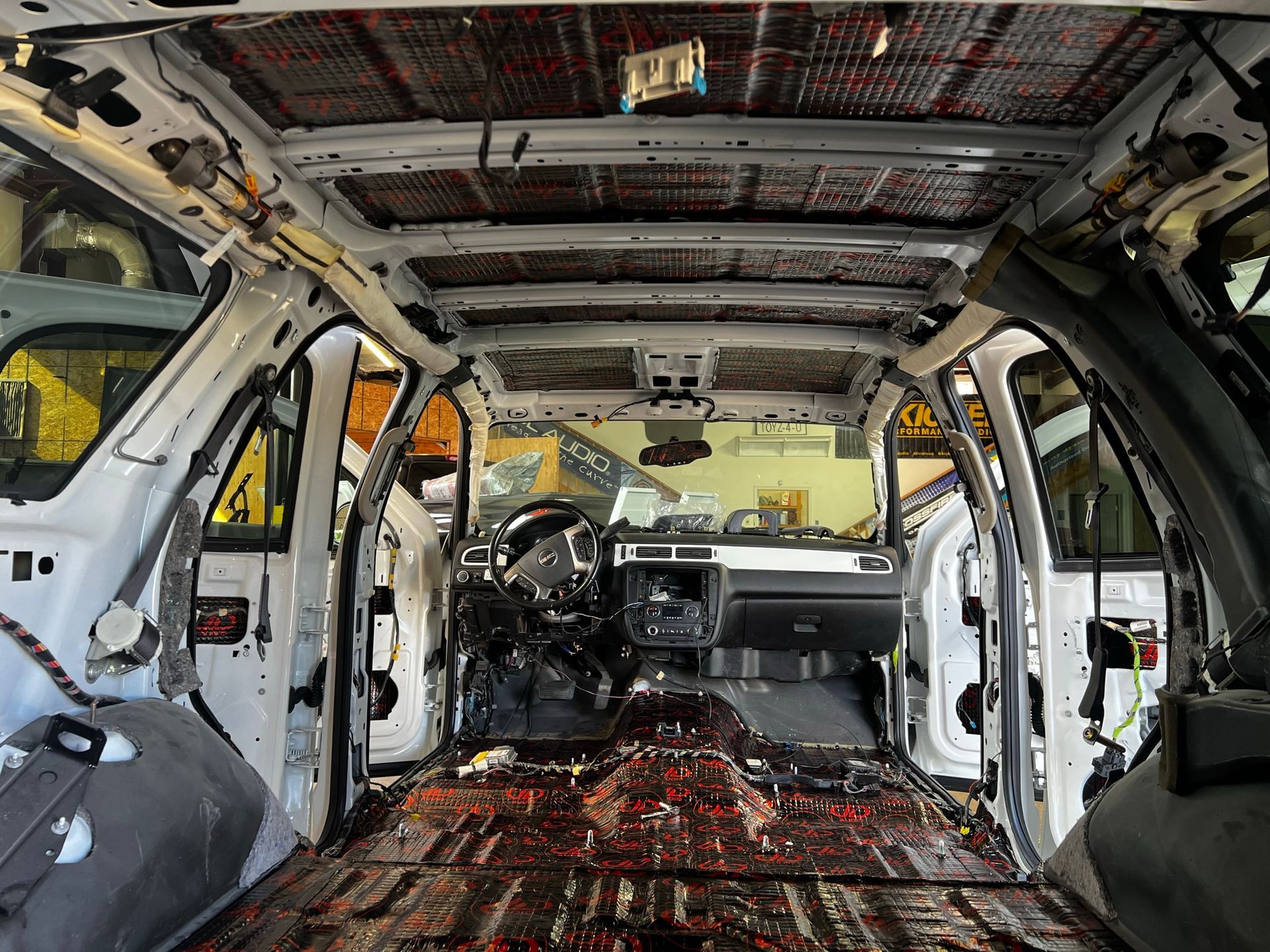 The inside of a white car with the roof removed.
