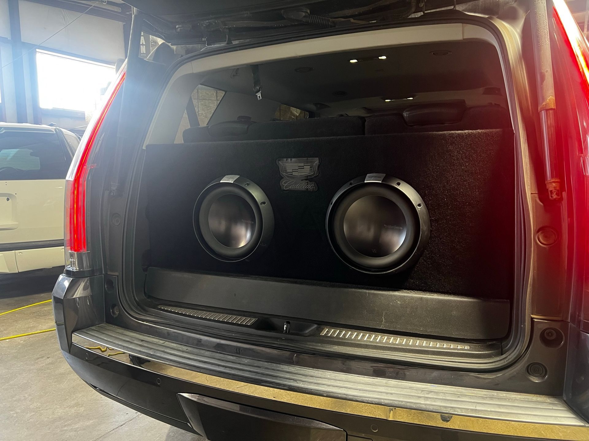 A car with a subwoofer in the back of it.
