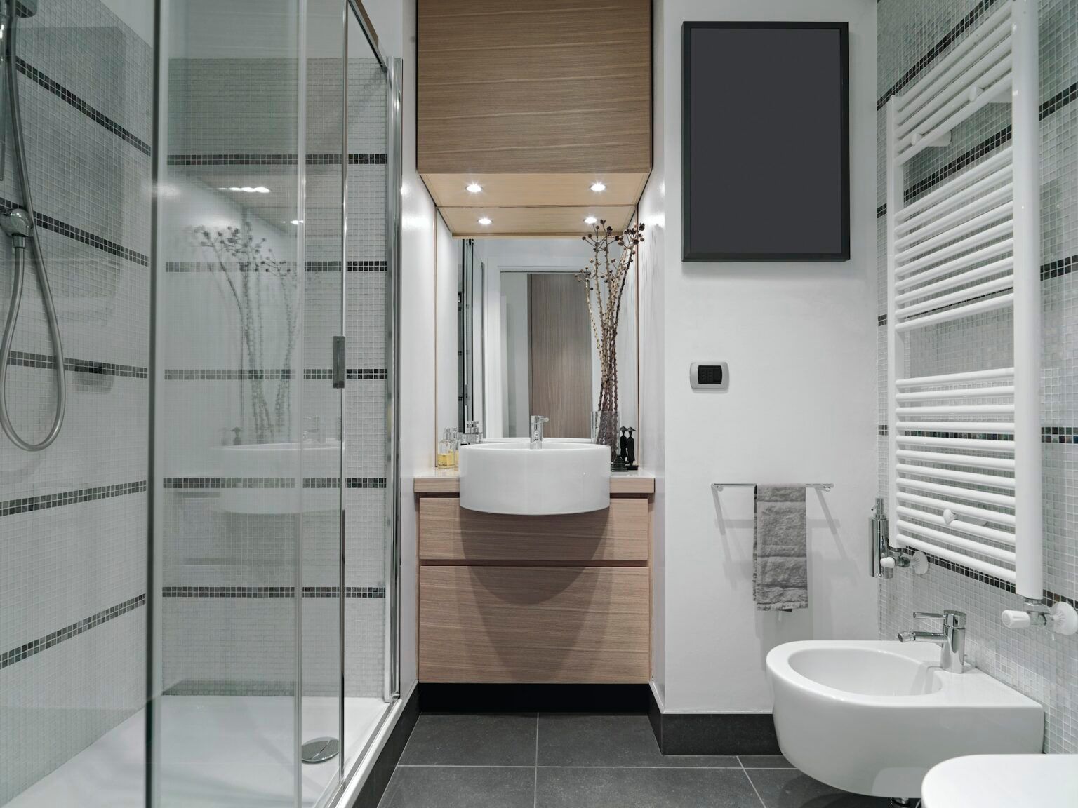 A bathroom with a sink , toilet , and shower.