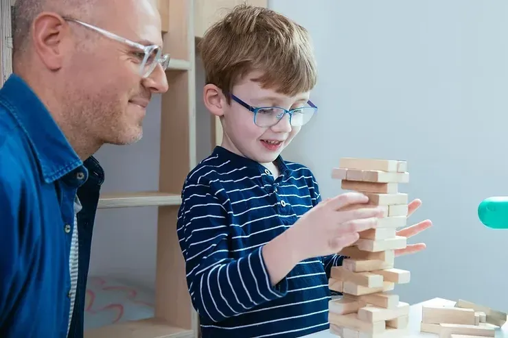 Student playing jenga