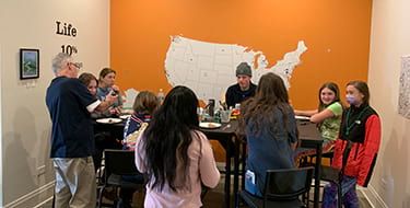 Northfield students at a table celebrating Pi day