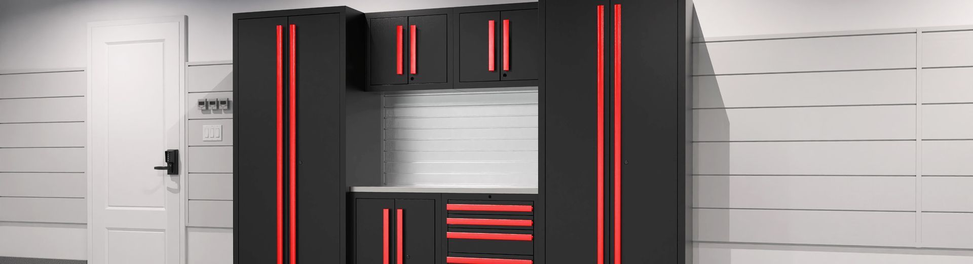 Black and red cabinets and drawers against a white wall. Includes a white door on the left side.