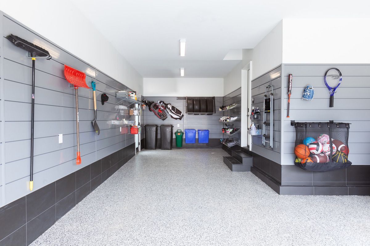 A CrownWall Slatwall Organization System with Sports Equipment Storage Organizers