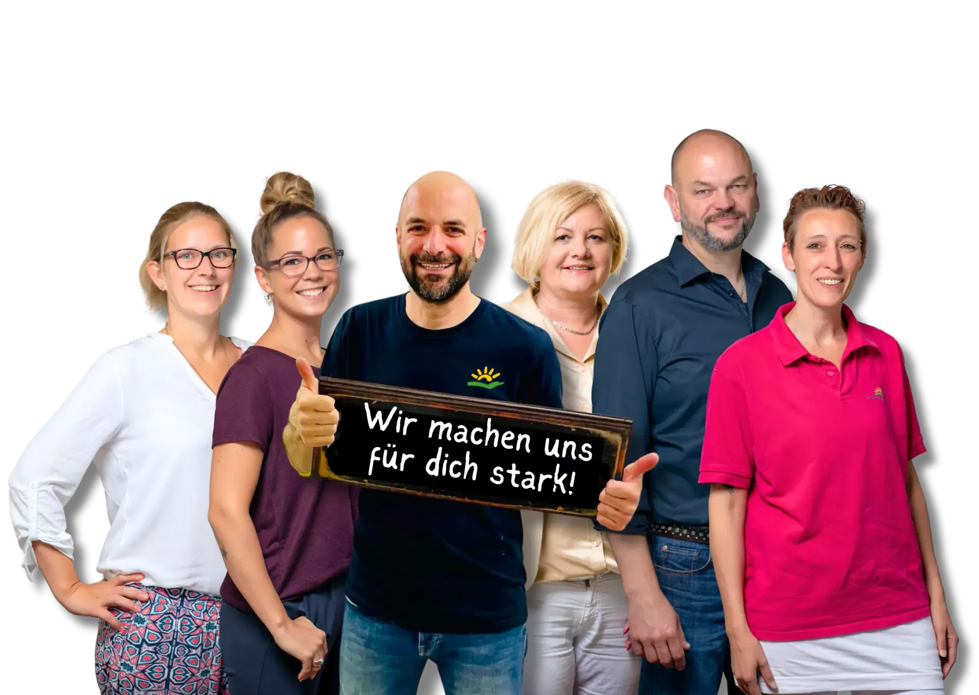 Eine Gruppe von Menschen steht nebeneinander und hält ein Schild mit der Aufschrift „Wir machen uns für dich stark“.