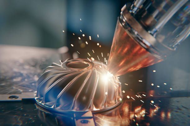 A modern 3D printer is printing a metal turbine.