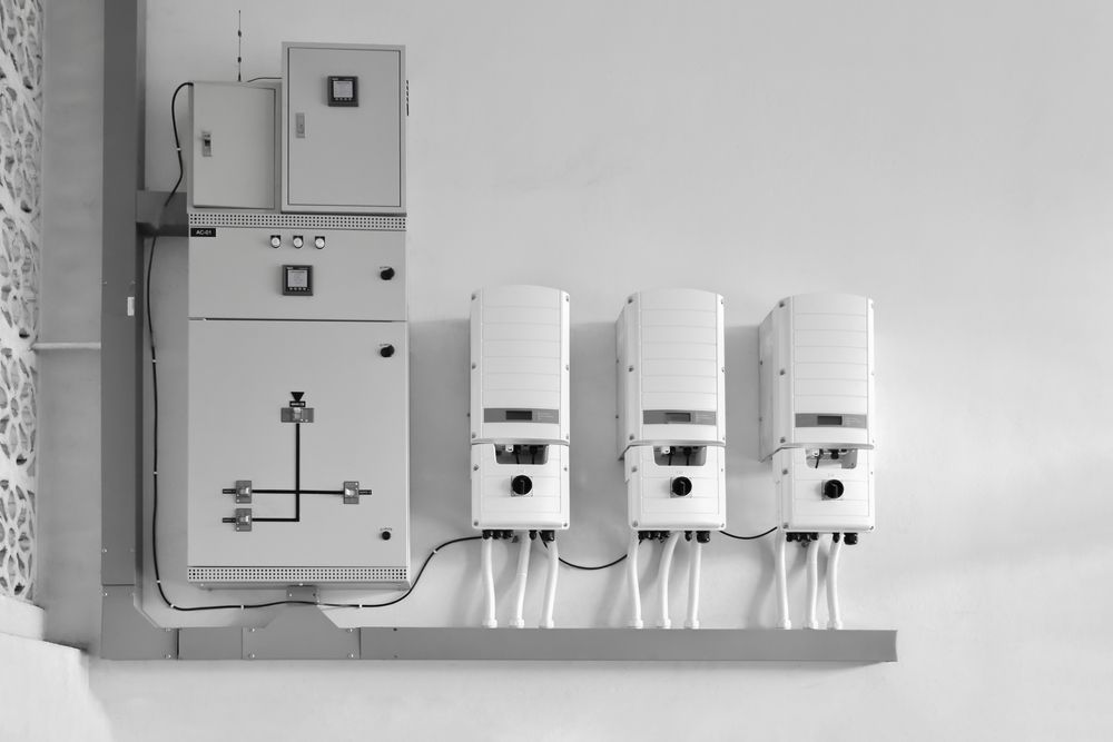 A Photo of A Row of Solar Inverters Mounted on A Wall — Ryde Energy in Browns Plains, QLD