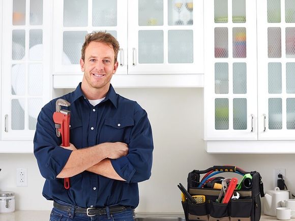 Plumber Holding Tools — Plumber in Moranbah, QLD