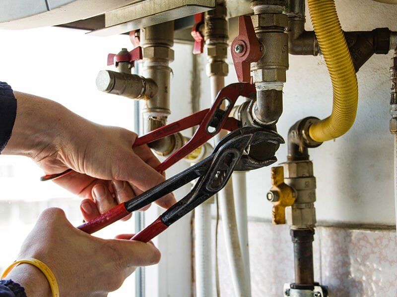Plumber Repairing Pipe — Commercial Plumber in Moranbah, QLD Plumber Repairing Pipe — Commercial Plumber in Moranbah, QLD