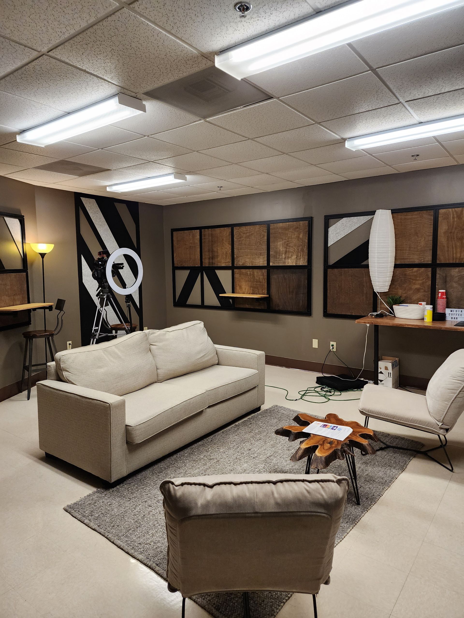 A living room with a couch and chairs in it