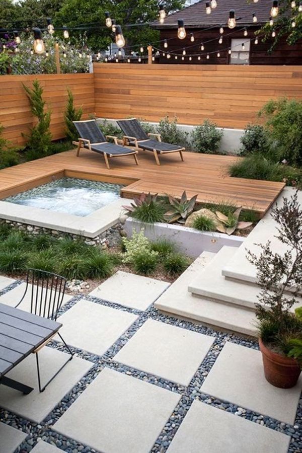 Small dreamy outdoor living space with hanging lights
