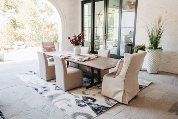 small outdoor seating area with dining table and seating